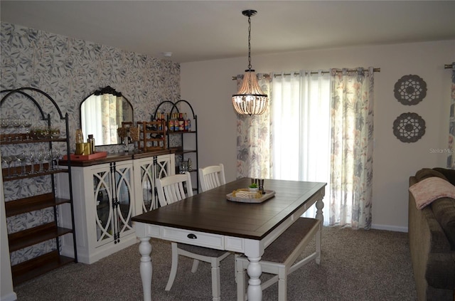 35 Putter Dr, Palm Coast, FL 32164 - dining room with wallpapered walls, a chandelier, and carpet