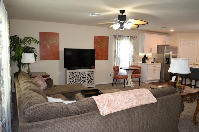 35 Putter Dr, Palm Coast, FL 32164 - carpeted living area with a ceiling fan
