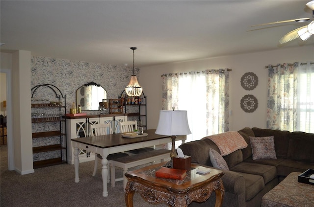 35 Putter Dr, Palm Coast, FL 32164 - carpeted living room featuring a ceiling fan, wallpapered walls, and a chandelier