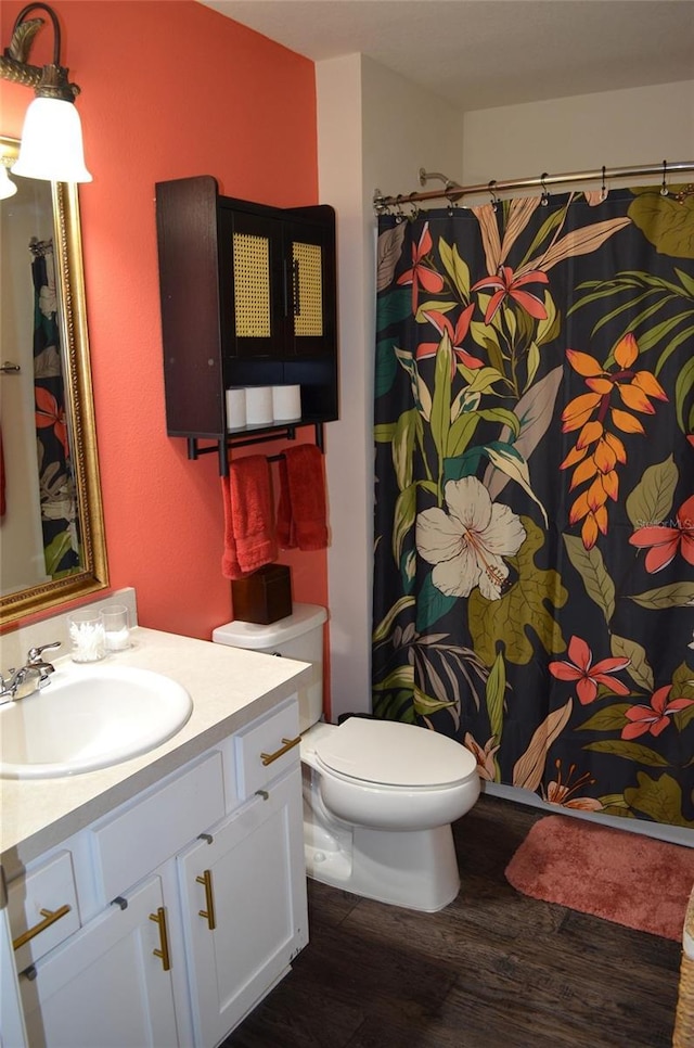 35 Putter Dr, Palm Coast, FL 32164 - bathroom featuring wood finished floors, vanity, and a shower with shower curtain