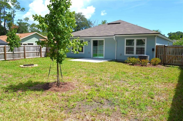 35 Putter Dr, Palm Coast, FL 32164 - rear view of property with a fenced backyard, an outdoor fire pit, a patio area, stucco siding, and a shingled roof