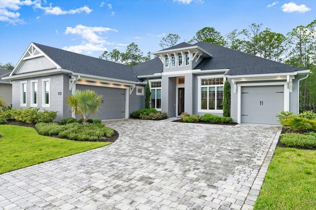 476 Stirling Bridge Dr, Ormond Beach, FL 32174 - view of front facade with an attached garage, decorative driveway, and stucco siding
