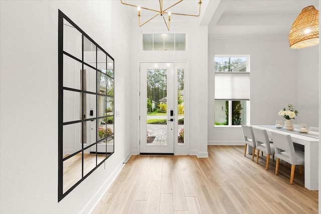 476 Stirling Bridge Dr, Ormond Beach, FL 32174 - entryway with wood finished floors and a chandelier