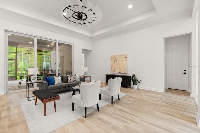 476 Stirling Bridge Dr, Ormond Beach, FL 32174 - living area featuring a tray ceiling, light wood-style floors, and recessed lighting