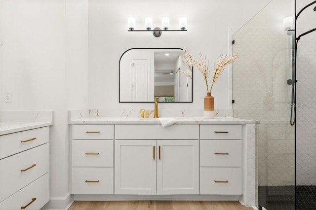 476 Stirling Bridge Dr, Ormond Beach, FL 32174 - bathroom featuring vanity, a shower stall, and wood finished floors