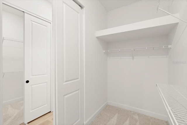 476 Stirling Bridge Dr, Ormond Beach, FL 32174 - walk in closet featuring light carpet