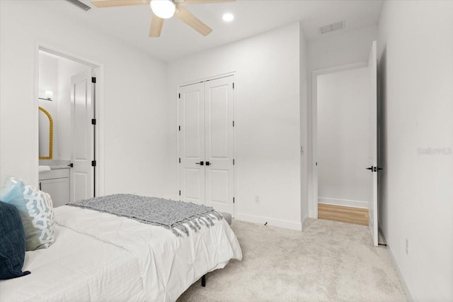 476 Stirling Bridge Dr, Ormond Beach, FL 32174 - bedroom with light carpet, a closet, connected bathroom, ceiling fan, and recessed lighting