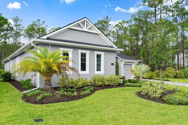 476 Stirling Bridge Dr, Ormond Beach, FL 32174 - view of front of property with stucco siding, a front yard, and an attached garage