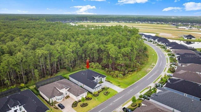 476 Stirling Bridge Dr, Ormond Beach, FL 32174 - aerial perspective of suburban area with a heavily wooded area