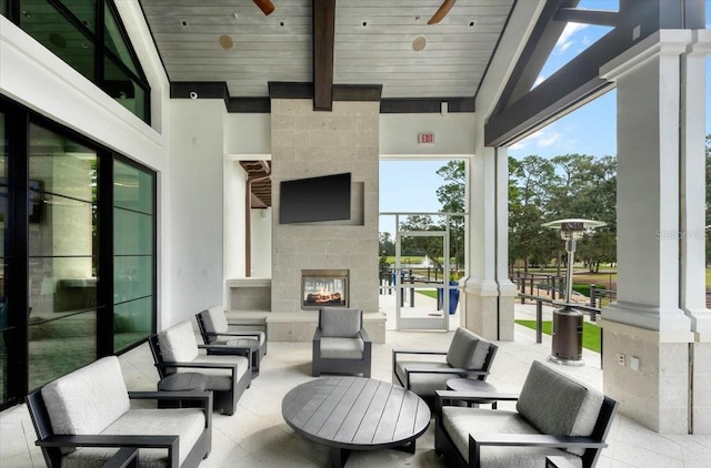 476 Stirling Bridge Dr, Ormond Beach, FL 32174 - view of patio featuring a ceiling fan and an outdoor living space with a fireplace