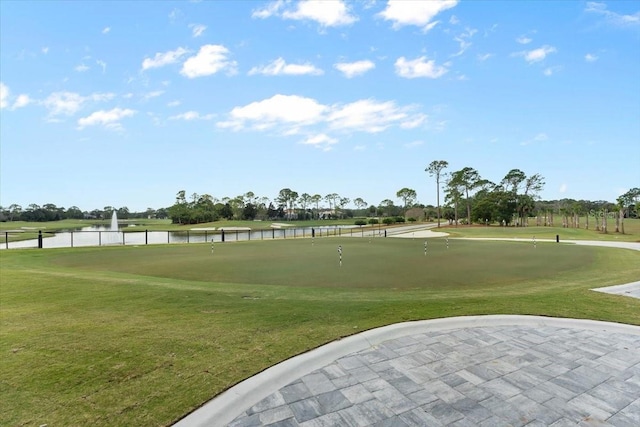476 Stirling Bridge Dr, Ormond Beach, FL 32174 - view of community featuring a putting green, a water view, a lawn, and golf course view