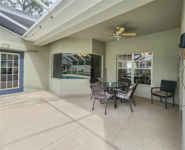 8 Wiltshire Pl, Palm Coast, FL 32164 - view of patio featuring a ceiling fan, an outdoor pool, glass enclosure, and outdoor dining area
