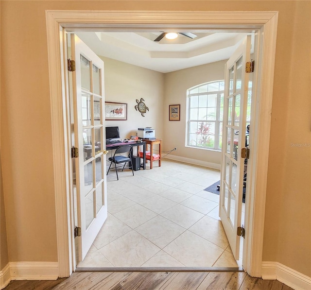 8 Wiltshire Pl, Palm Coast, FL 32164 - office featuring french doors, a tray ceiling, and a ceiling fan
