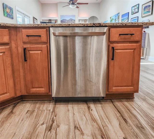 8 Wiltshire Pl, Palm Coast, FL 32164 - kitchen with dishwasher, light wood-style floors, ceiling fan, brown cabinets, and light stone counters