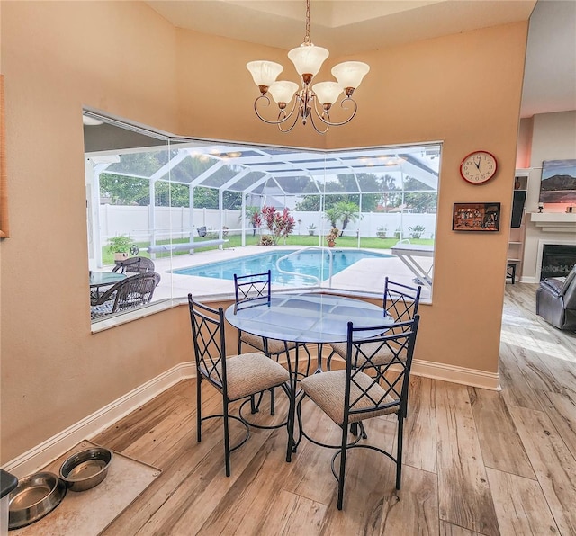 8 Wiltshire Pl, Palm Coast, FL 32164 - dining space featuring hardwood / wood-style flooring, a sunroom, and plenty of natural light