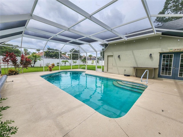8 Wiltshire Pl, Palm Coast, FL 32164 - view of pool featuring french doors, a patio area, a yard, and a lanai