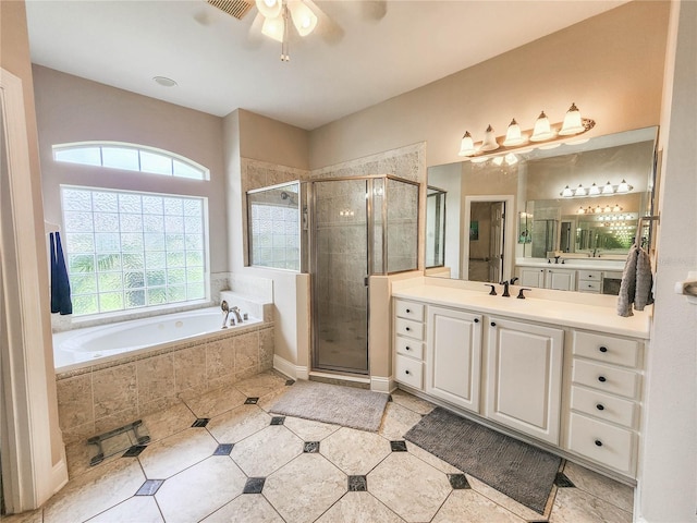 8 Wiltshire Pl, Palm Coast, FL 32164 - bathroom featuring plenty of natural light, a bath, vanity, and a shower stall
