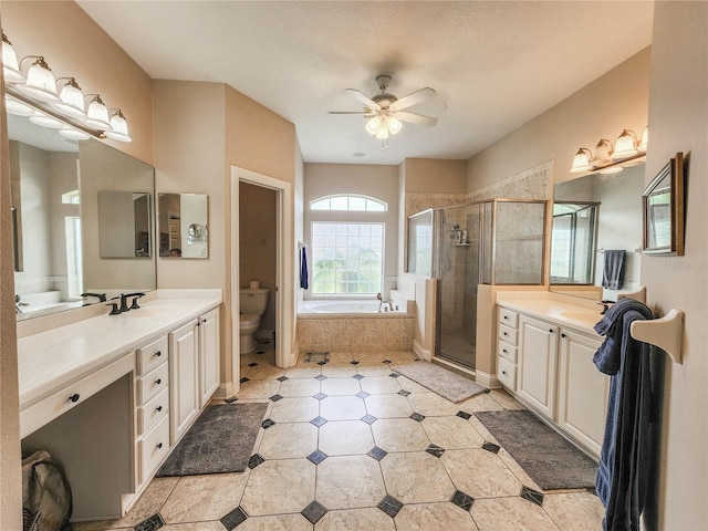 8 Wiltshire Pl, Palm Coast, FL 32164 - full bathroom with a shower stall, a garden tub, two vanities, tile patterned flooring, and a ceiling fan