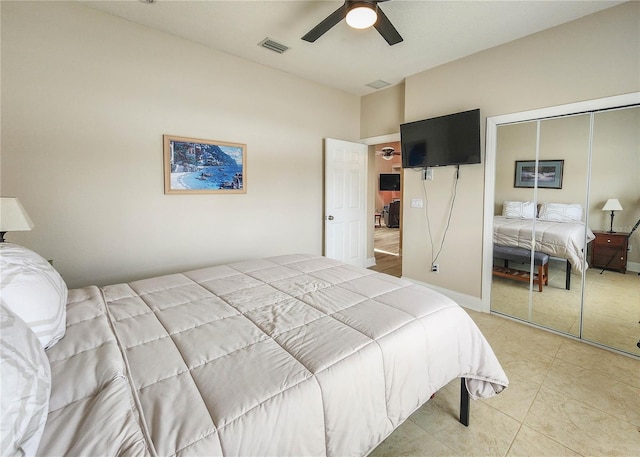 8 Wiltshire Pl, Palm Coast, FL 32164 - bedroom with a closet, light tile patterned flooring, and a ceiling fan