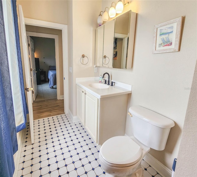 8 Wiltshire Pl, Palm Coast, FL 32164 - ensuite bathroom featuring vanity and toilet