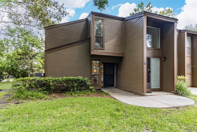 11 Surrey Ct Unit 11, Palm Coast, FL 32137 - view of front of house featuring a front yard
