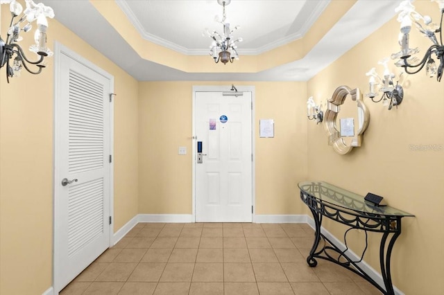 200 Ocean Crest Dr Unit 813, Palm Coast, FL 32137 - entrance foyer with a raised ceiling, light tile patterned floors, crown molding, and a chandelier