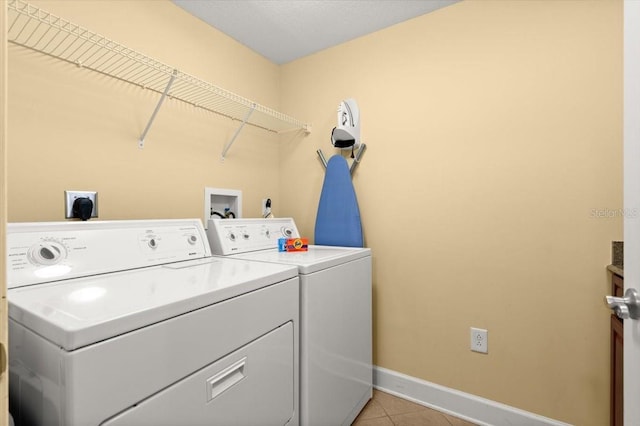 200 Ocean Crest Dr Unit 813, Palm Coast, FL 32137 - washroom featuring washing machine and clothes dryer and light tile patterned floors