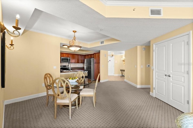 200 Ocean Crest Dr Unit 813, Palm Coast, FL 32137 - dining room with light carpet, ornamental molding, and a raised ceiling