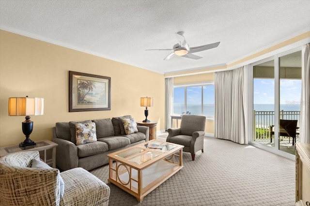 200 Ocean Crest Dr Unit 813, Palm Coast, FL 32137 - living room with a water view, ceiling fan, ornamental molding, plenty of natural light, and light carpet