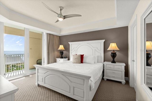 200 Ocean Crest Dr Unit 813, Palm Coast, FL 32137 - bedroom with carpet, access to outside, a raised ceiling, a water view, and a ceiling fan