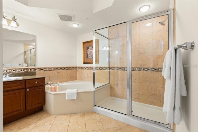 200 Ocean Crest Dr Unit 813, Palm Coast, FL 32137 - full bathroom with tile patterned floors, vanity, a stall shower, a bath, and tile walls