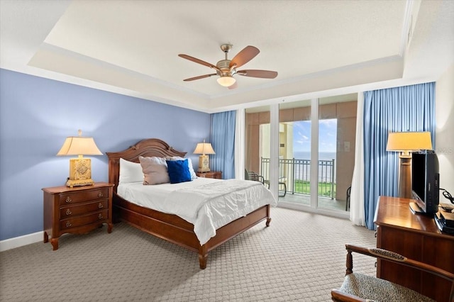 200 Ocean Crest Dr Unit 813, Palm Coast, FL 32137 - carpeted bedroom featuring a raised ceiling, access to outside, a ceiling fan, and ornamental molding