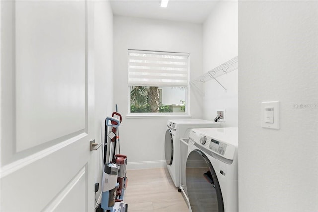 23 Ocean Ridge Blvd N, Palm Coast, FL 32137 - laundry room with separate washer and dryer and light wood finished floors