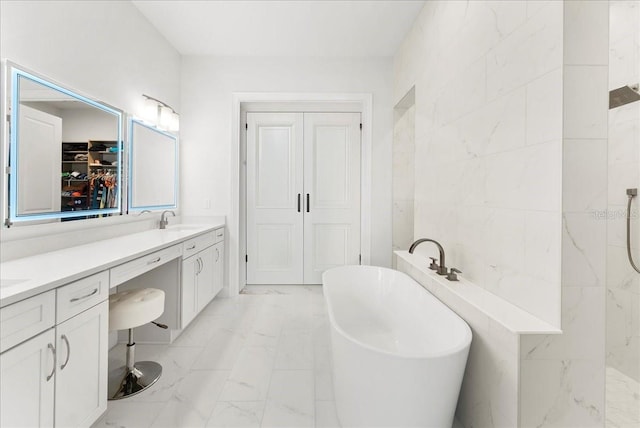 23 Ocean Ridge Blvd N, Palm Coast, FL 32137 - full bath featuring marble finish flooring, double vanity, a freestanding tub, tile walls, and a tile shower