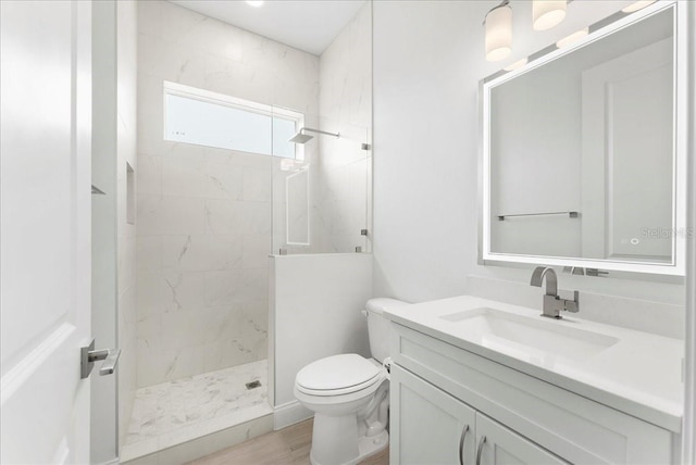 23 Ocean Ridge Blvd N, Palm Coast, FL 32137 - bathroom featuring vanity, tiled shower, and wood finished floors