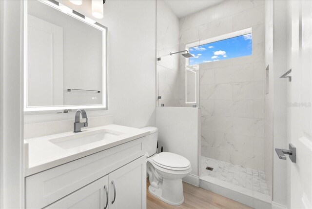 23 Ocean Ridge Blvd N, Palm Coast, FL 32137 - full bathroom with a marble finish shower, vanity, and wood finished floors