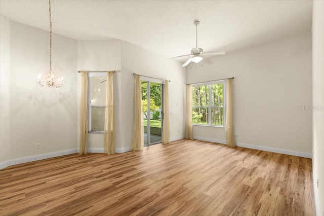 1707 Southern Belle Ln, Port Orange, FL 32128 - unfurnished room with a ceiling fan, wood finished floors, and a chandelier