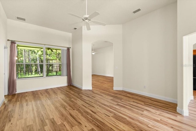 1707 Southern Belle Ln, Port Orange, FL 32128 - unfurnished room featuring a ceiling fan, light wood-type flooring, and arched walkways
