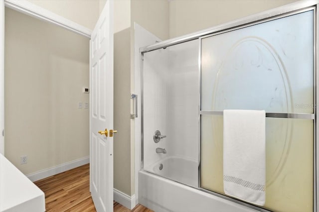 1707 Southern Belle Ln, Port Orange, FL 32128 - full bathroom with wood finished floors and combined bath / shower with glass door