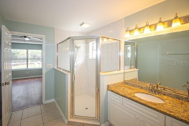9 Empress Ln, Palm Coast, FL 32164 - full bath with a stall shower, tile patterned flooring, and vanity