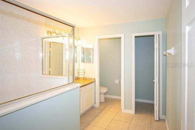 9 Empress Ln, Palm Coast, FL 32164 - bathroom with vanity and tile patterned flooring
