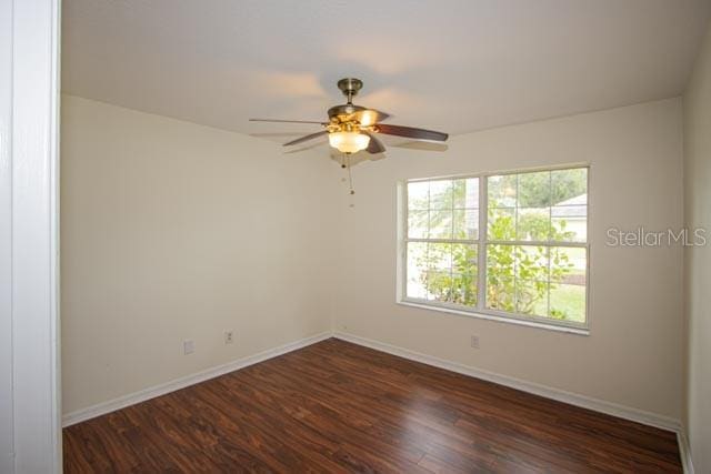 9 Empress Ln, Palm Coast, FL 32164 - unfurnished room with dark wood finished floors and ceiling fan
