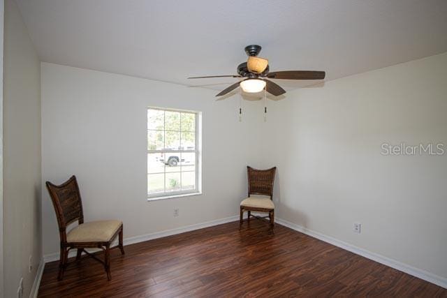 9 Empress Ln, Palm Coast, FL 32164 - sitting room featuring dark wood-type flooring and ceiling fan