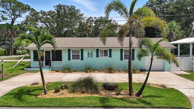 1146 Riverside Dr, Daytona Beach, FL 32117 - ranch-style house featuring crawl space, concrete driveway, a front lawn, a garage, and a shingled roof