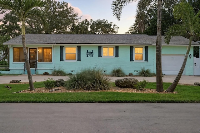 1146 Riverside Dr, Daytona Beach, FL 32117 - ranch-style home featuring an attached garage
