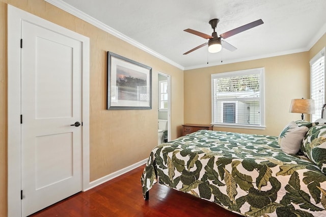 1146 Riverside Dr, Daytona Beach, FL 32117 - bedroom with dark wood finished floors, ornamental molding, multiple windows, ceiling fan, and ensuite bathroom