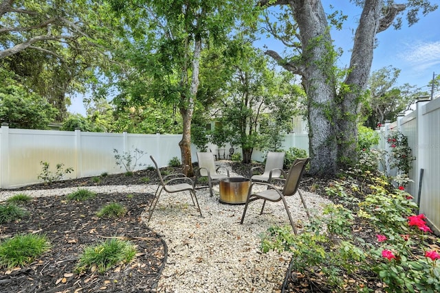 1146 Riverside Dr, Daytona Beach, FL 32117 - fenced backyard with a patio area