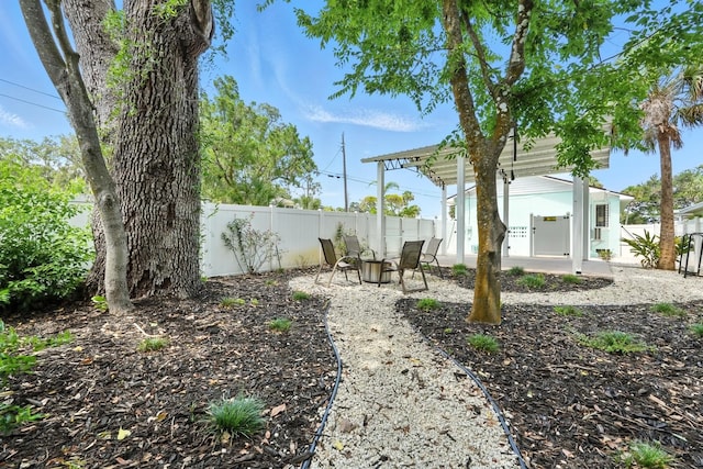 1146 Riverside Dr, Daytona Beach, FL 32117 - fenced backyard with a patio area