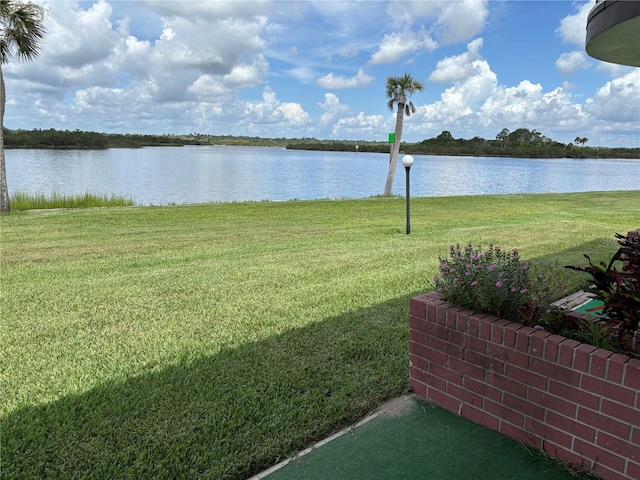 32 S Ocean Palm Villa Dr S Unit 320, Flagler Beach, FL 32136 - view of green lawn with a water view