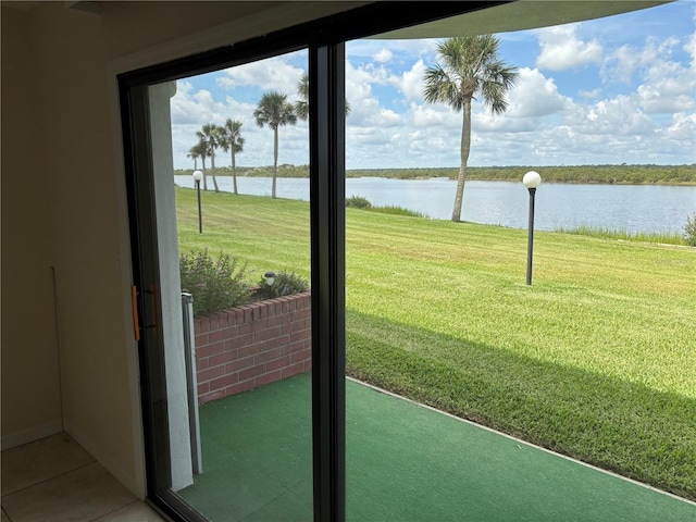 32 S Ocean Palm Villa Dr S Unit 320, Flagler Beach, FL 32136 - doorway to outside featuring a water view and tile patterned flooring